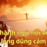 Thành ngữ về lòng dũng cảm, với hình ảnh minh họa một người đang leo núi, tượng trưng cho sự kiên trì và dũng cảm đối mặt với thử thách.