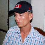 Tuấn Amo tại cơ quan công an, thể hiện sự ăn năn hối cải sau khi bị bắt giữ vì các hoạt động phi pháp.